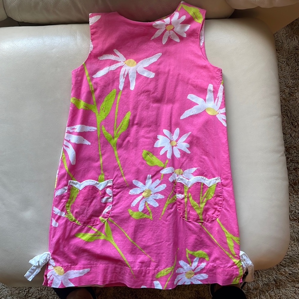 Pink dress with flower detail and tie sides
